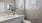 a bathroom with a sink, toilet and flowers