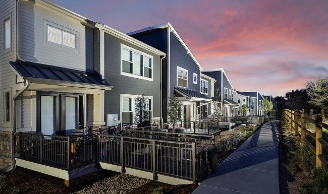 Find your perfect fit at Avere on Highline a row of apartments with fenced-in lawns