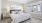 a bedroom with a bed and lamps