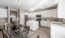 a kitchen with white cabinets