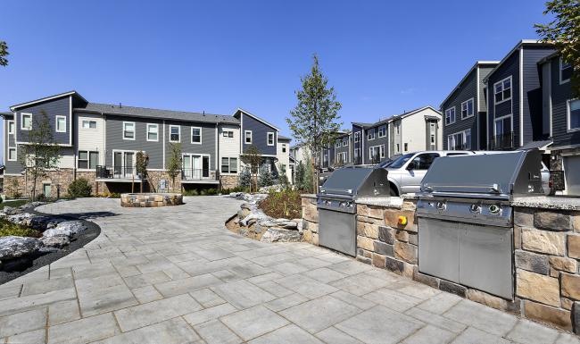 Settle into comfort at Avere on Highline a stone paved area with a grilling station